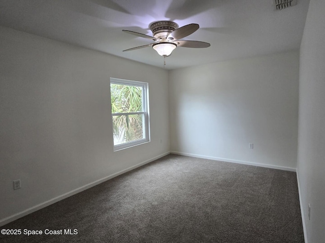 spare room with carpet flooring and ceiling fan