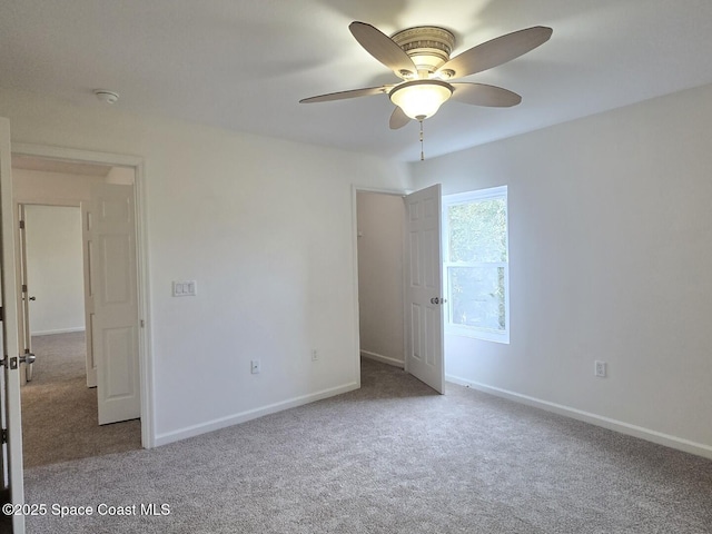 unfurnished room featuring carpet flooring and ceiling fan