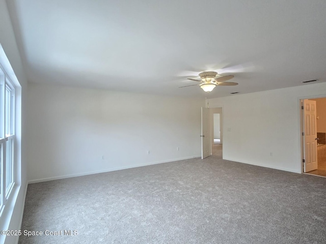 empty room featuring carpet and ceiling fan