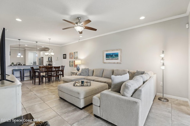 living room featuring ceiling fan with notable chandelier, crown molding, and light tile patterned flooring