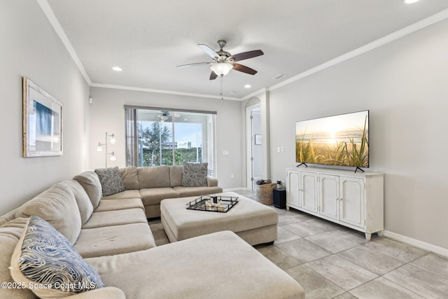 living room featuring ceiling fan, light tile patterned flooring, and ornamental molding