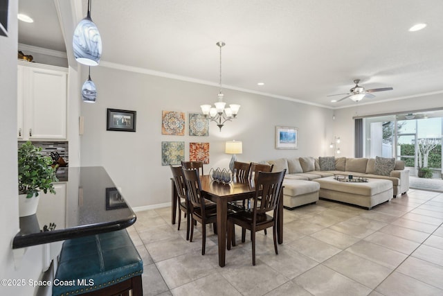 tiled dining room with ornamental molding and ceiling fan with notable chandelier