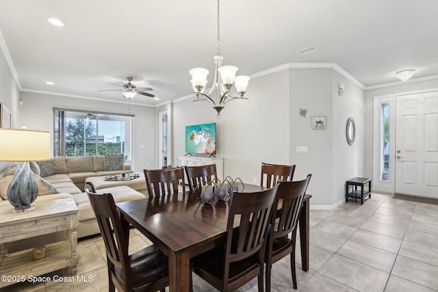 dining room featuring ceiling fan with notable chandelier, light tile patterned floors, and ornamental molding