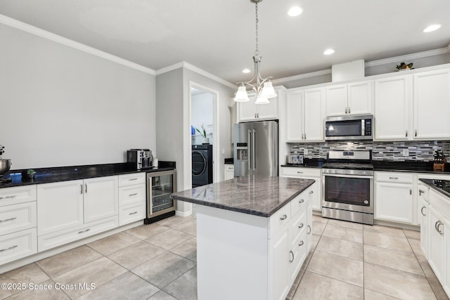 kitchen featuring a center island, white cabinetry, stainless steel appliances, light tile patterned floors, and beverage cooler