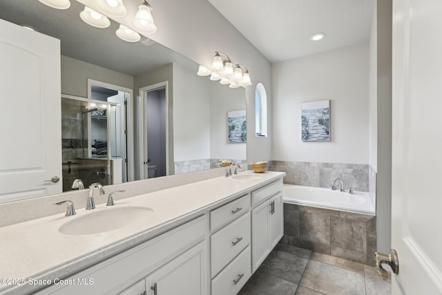 full bathroom featuring toilet, vanity, plus walk in shower, and tile patterned flooring