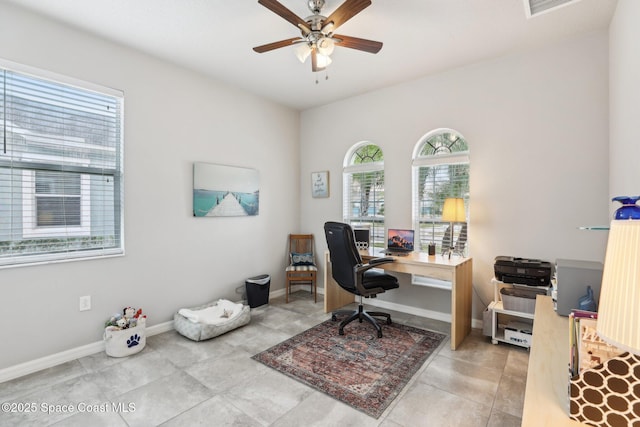 tiled office space with ceiling fan and a wealth of natural light