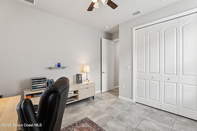 home office featuring ceiling fan and light tile patterned floors