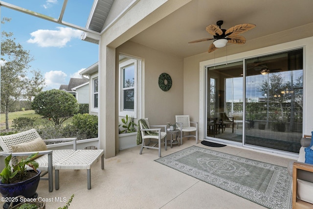 view of patio featuring ceiling fan