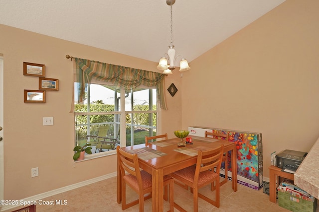 tiled dining room with vaulted ceiling and a chandelier