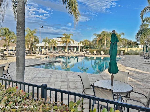 view of swimming pool with a patio area