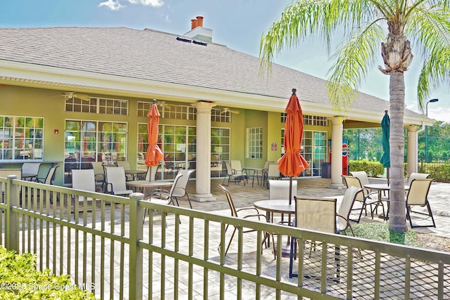 exterior space featuring ceiling fan