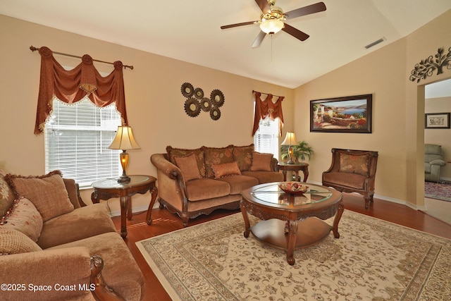 living room featuring ceiling fan, vaulted ceiling, and wood-type flooring