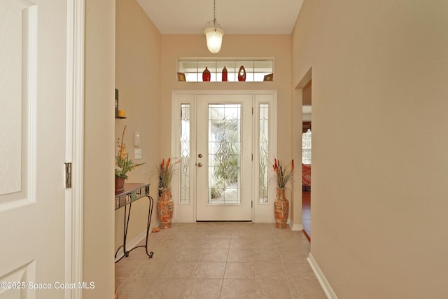 foyer featuring light tile patterned flooring