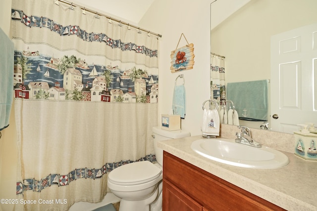 bathroom with toilet and vanity