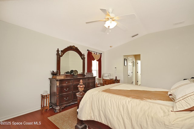 bedroom featuring vaulted ceiling, ceiling fan, and dark hardwood / wood-style floors