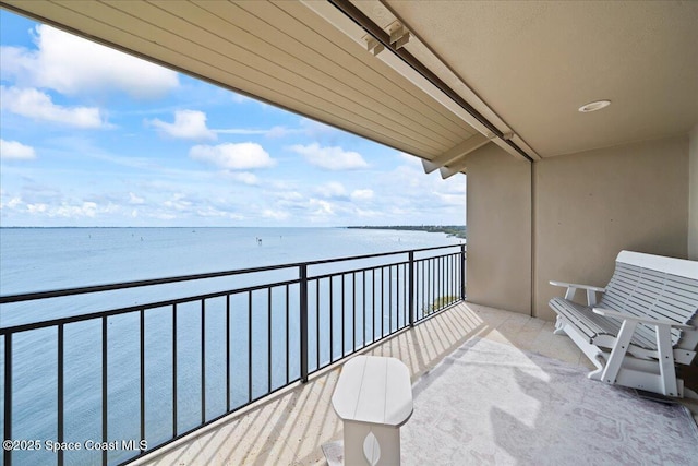 balcony featuring a water view