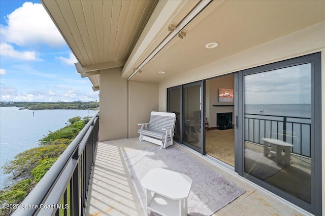 balcony featuring a water view