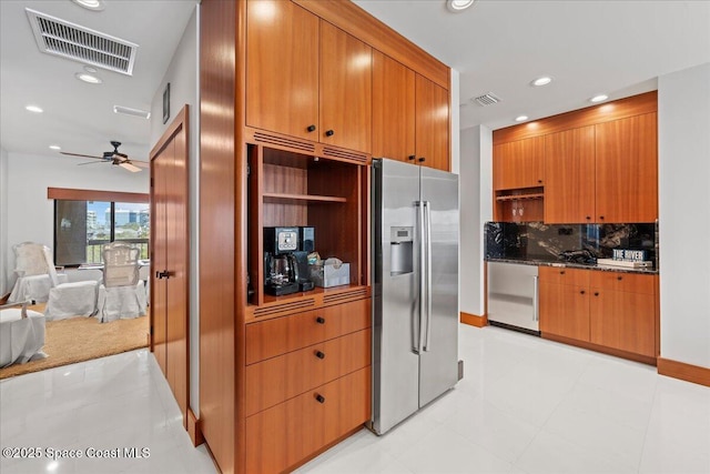 kitchen with backsplash, ceiling fan, and stainless steel appliances