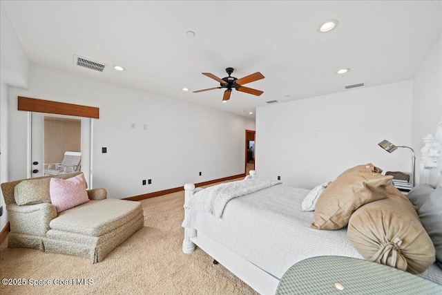 bedroom with ceiling fan and light carpet