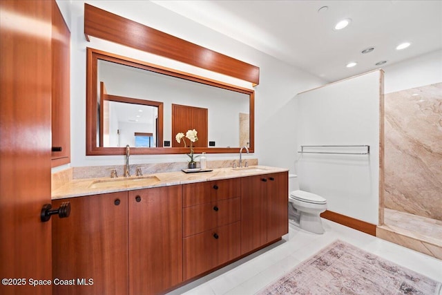 bathroom with tiled shower, toilet, and vanity