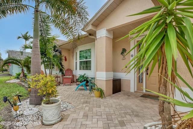 doorway to property featuring a patio area