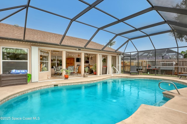 view of pool featuring a lanai and a patio area