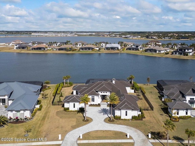 birds eye view of property featuring a water view