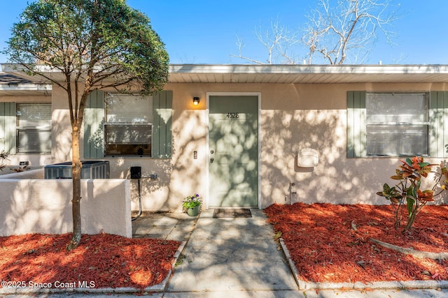 4528 Memory Ln, Titusville, FL 32780 - view of exterior entry featuring central AC