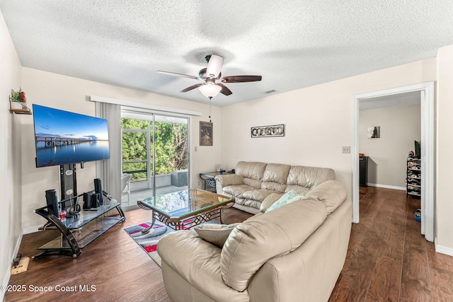 living room with wood-type flooring, a textured ceiling, and ceiling fan