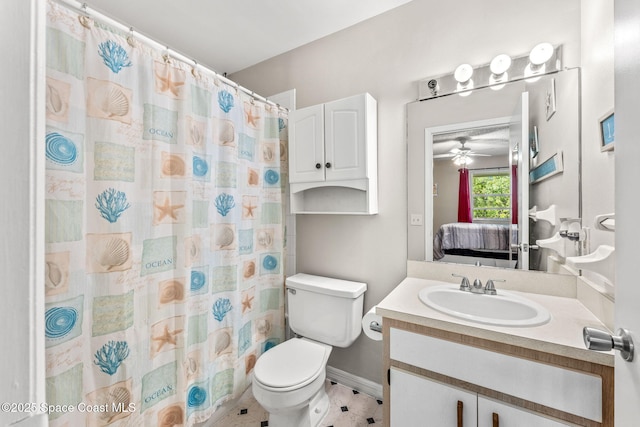 bathroom with a shower with curtain, ceiling fan, toilet, and vanity