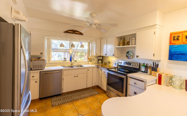 kitchen featuring a sink, a ceiling fan, white cabinets, appliances with stainless steel finishes, and open shelves