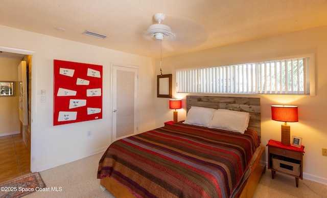 bedroom featuring visible vents, ceiling fan, and baseboards