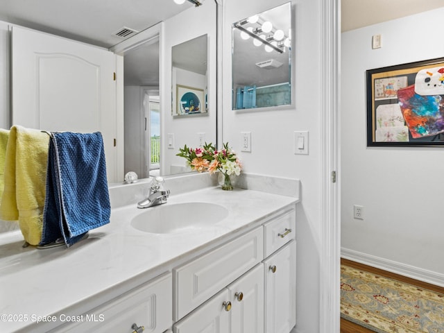 bathroom featuring vanity and wood-type flooring