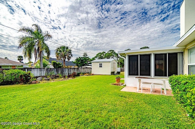 view of yard featuring a storage unit and a patio area