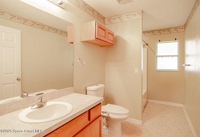 full bathroom featuring toilet, vanity, a textured ceiling, and shower / bathing tub combination