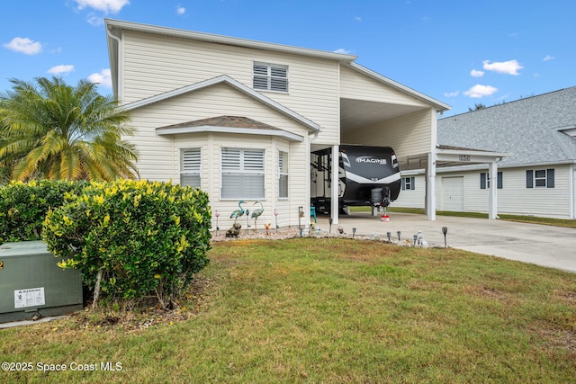 view of front of property with a front yard and a carport