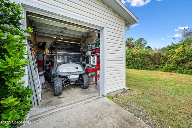 garage featuring a yard