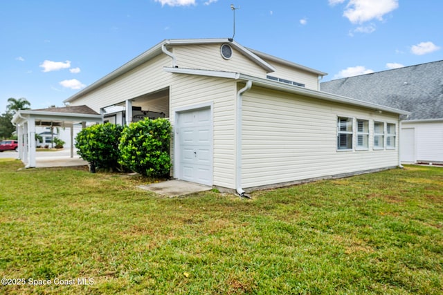 view of side of home featuring a yard