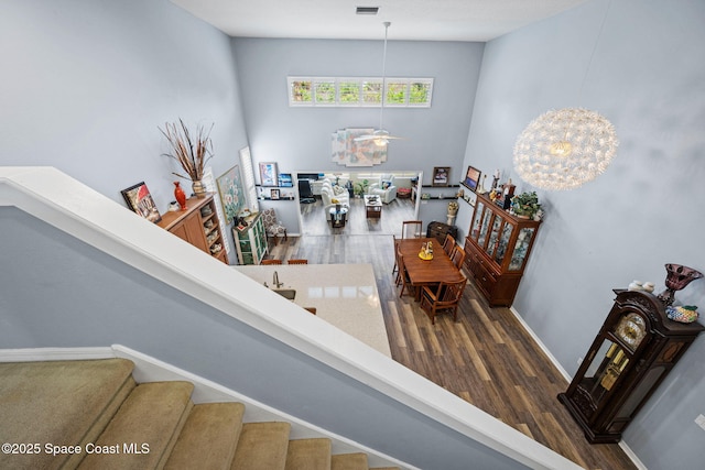 staircase with hardwood / wood-style floors