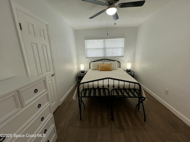 bedroom featuring ceiling fan and dark wood-type flooring