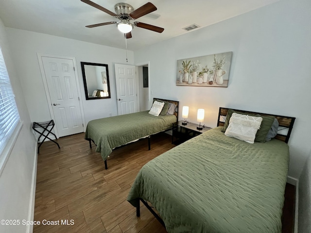 bedroom with hardwood / wood-style flooring and ceiling fan