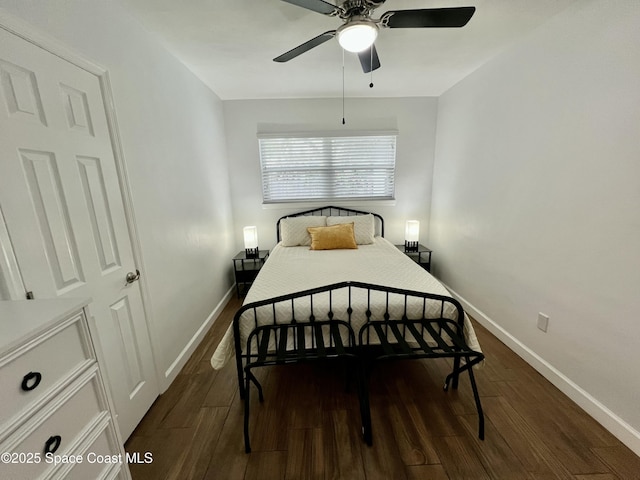 bedroom with ceiling fan and dark wood-type flooring