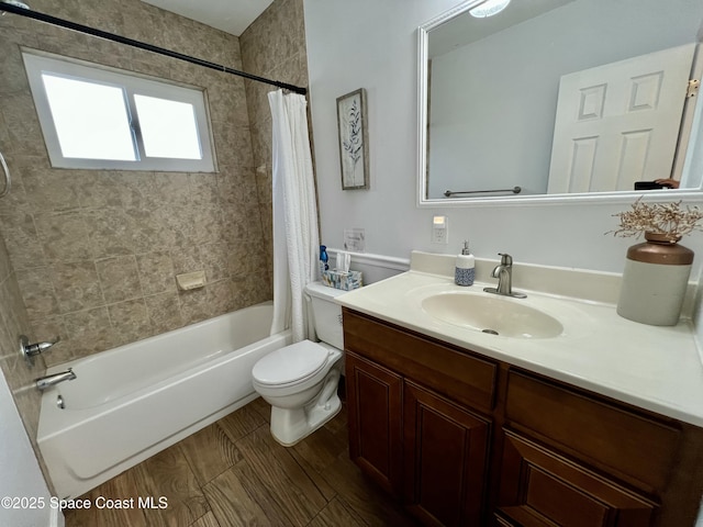 full bathroom featuring vanity, toilet, and shower / tub combo with curtain