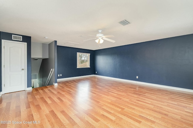 spare room with ceiling fan and light hardwood / wood-style floors