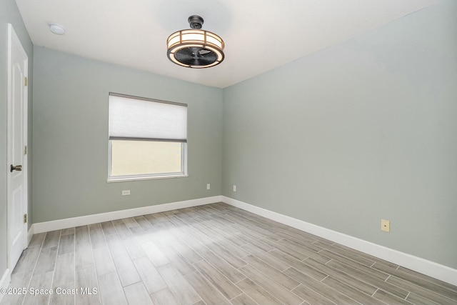 unfurnished room featuring light hardwood / wood-style floors