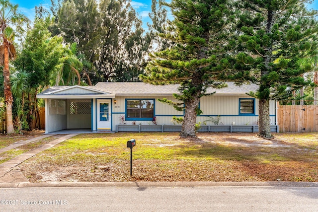 view of front of property with a carport