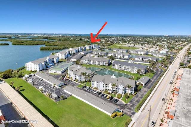 birds eye view of property featuring a water view