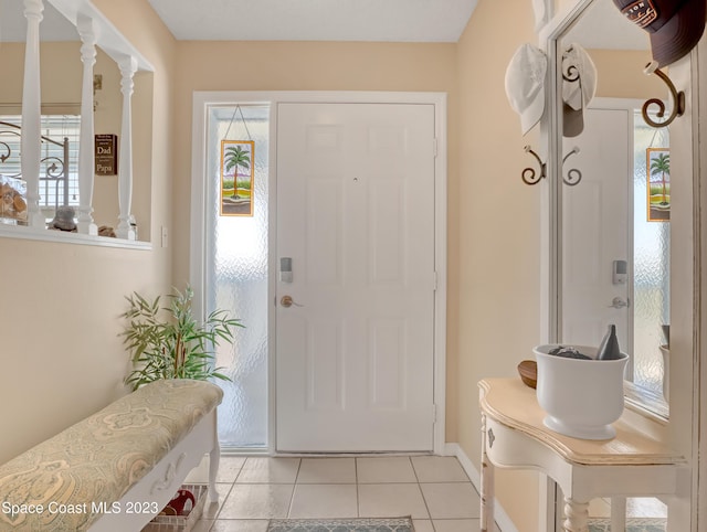 entrance foyer with light tile patterned flooring