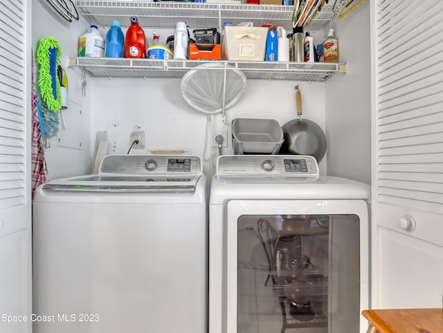 washroom with separate washer and dryer