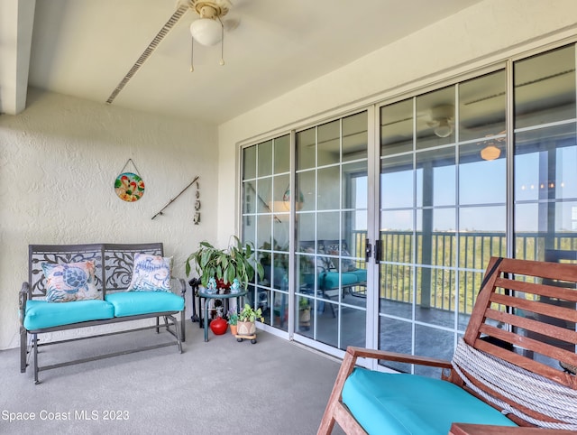 sunroom / solarium with ceiling fan